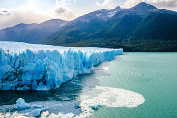 Ice collapsing into the water at Perito Moreno Glacier in Los Glaciares National Park near El...