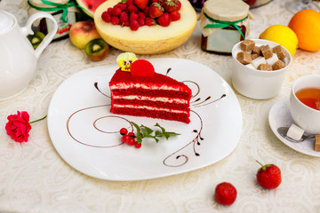delicious red velvet cake on a chocolate-plated plate