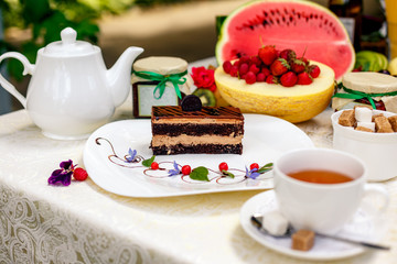 cake with biscuitly chocolate tenderness, a glaze made from natural high-quality Belgian chocolate and a delicate chocolate cream