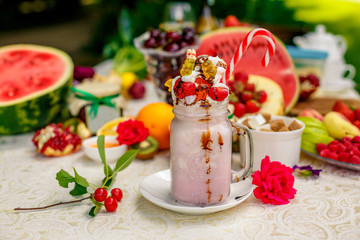 Crazy shake on top with a strawberry marmalade and candy and marmalade bears on a bright colored background