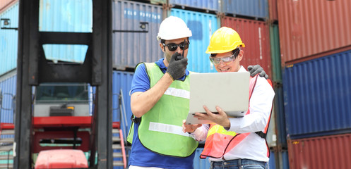 Engineering group working and they are loading container for support logistics and import export business