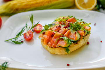 sandwich with bread fish and cucumber