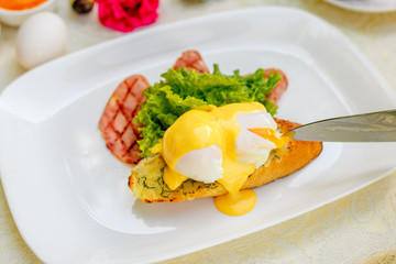 breakfast with garlic cheese bread, with egg salad leaves and bacon
