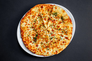 freshly baked flat bread with greens