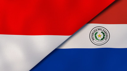 The flags of Indonesia and Paraguay. News, reportage, business background. 3d illustration