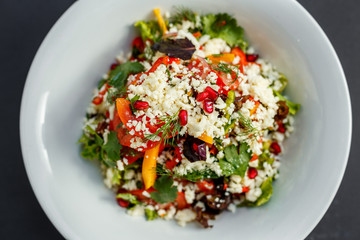 vegetarian salad healthy food with pomegranate cheese and pepper