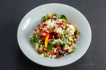 vegetarian salad healthy food with pomegranate cheese and pepper
