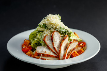 Caesar salad with chicken and crackers