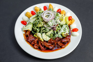 Mix of five types of lettuce (iceberg, batavia, spinach, arugula, lollo rossa) and crispy cucumbers in a dressing from Greek yogurt