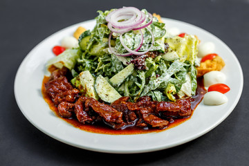 Mix of five types of lettuce (iceberg, batavia, spinach, arugula, lollo rossa) and crispy cucumbers in a dressing from Greek yogurt
