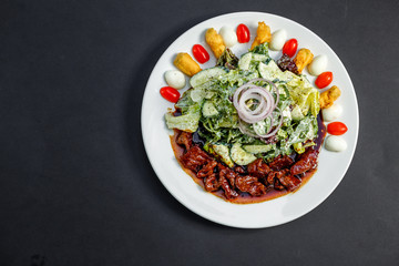 Mix of five types of lettuce (iceberg, batavia, spinach, arugula, lollo rossa) and crispy cucumbers in a dressing from Greek yogurt