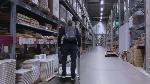 The shopper has a lot of fun while inside the warehouse in Finland