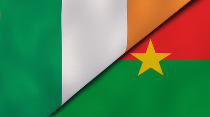 The flags of Ireland and Burkina Faso. News, reportage, business background. 3d illustration