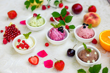 ice cream with fruits and different flavors (pistachio, chocolate, vanilla, cream)
