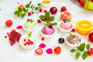 ice cream with fruits and different flavors (pistachio, chocolate, vanilla, cream)