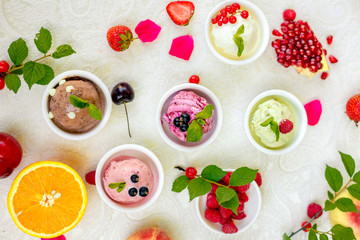 ice cream with fruits and different flavors (pistachio, chocolate, vanilla, cream)