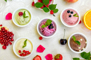 ice cream with fruits and different flavors (pistachio, chocolate, vanilla, cream)