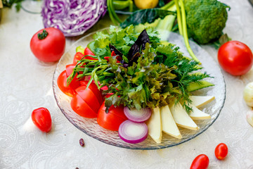 Fresh salad of tomato cucumber and pepper with greens, healthy food, vegetables