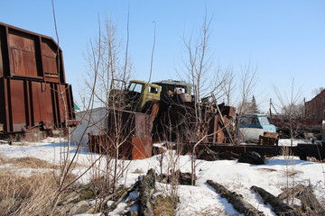 Fototapeta premium old rusty remnants of parts metal spare parts thrown into the landfill