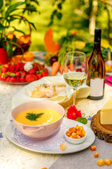 cheese soup with crackers on the holiday table