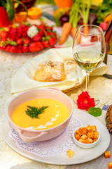 cheese soup with crackers on the holiday table