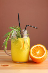 pineapple and orange cocktail. non alcoholic citrus summer drinks with citrus on wooden table. Deliciouse nature summer refreshing drink in glass.