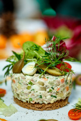 French salad Olivier served on the table