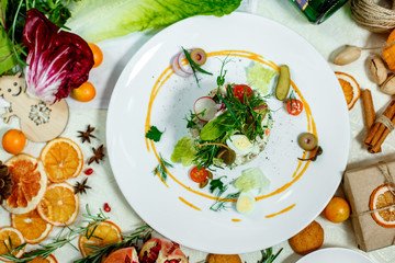 French salad Olivier served on the table