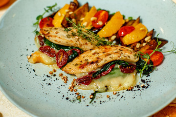 chicken breast with mashed potatoes and grilled vegetables and ingredients served on the table