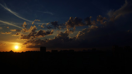 The sky in the city. Sun and clouds.