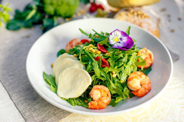 fresh salad with dried meat greens and vegetables on the table, healthy food