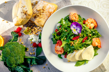 fresh salad with dried meat greens and vegetables on the table, healthy food