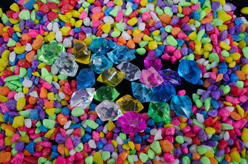 Fototapeta na wymiar Beautiful glass marbles and river rocks