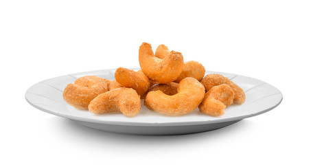 Cashews isolated in white plate on white background