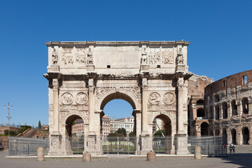 The Arch of Constantine (Arco di Costantino). .Triumphal arch and Colosseum on background. Rome, Italy - obrazy, fototapety, plakaty