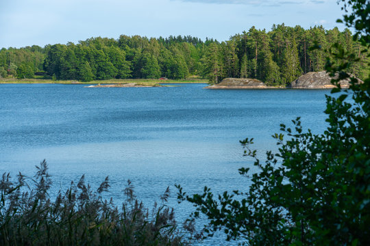 Ekenas, Vastra Nyland / Finland - July 2019: View of island over the bay on a summer day in Finland