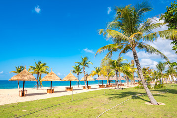 Fototapeta na wymiar Coastal Scenery of The Long Beach on Phu Quoc Island, Vietnam, a Popular Tourism Destination for Summer Vacation in Southeast Asia, with Tropical Climate and Beautiful Landscape.
