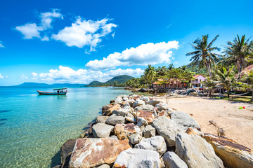 Coastal Scenery of The Long Beach on Phu Quoc Island, Vietnam, a Popular Tourism Destination for Summer Vacation in Southeast Asia, with Tropical Climate and Beautiful Landscape. - obrazy, fototapety, plakaty