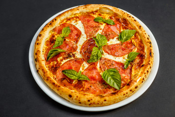 hot italian pizza with cheese and basil, isolated
