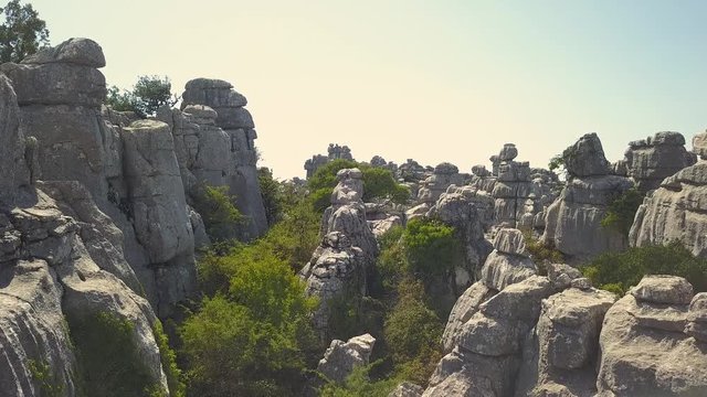 Cinematic aerial view of "El Torcal" mountain in Antequera. Drone flying close to the rocks. This rocks had their origin in the seabed during the Jurassic period, between 250 and 150 million years ago