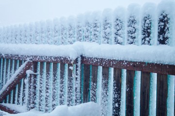 snowy village fence