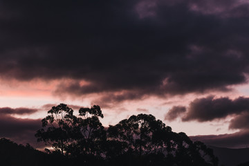 sunset sky over the hills and mountains in Tasmania, Australia with deep tones