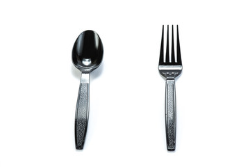 black plastic spoon and fork isolated on white background