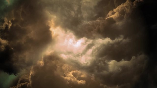 Flying through a lightning storm. 4K realistic animation of storm clouds in the sky. The camera travels forwards and spins slowly as lightning flashes.