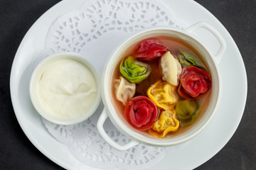 children's colored dumplings, dough made from beets, spinach and carrots by hand kneading and meat beef filling