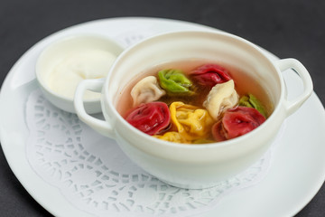 children's colored dumplings, dough made from beets, spinach and carrots by hand kneading and meat beef filling