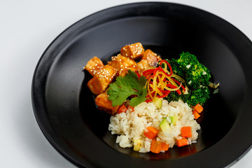 roast chicken fillet in Japanese sake-based sauce, white rice fried with spices, juicy vegetables with broccoli