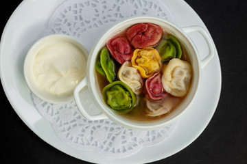 children's colored dumplings, dough made from beets, spinach and carrots by hand kneading and meat beef filling