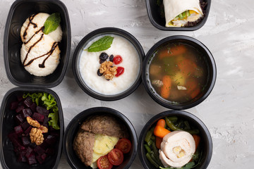 gluten free first course meal and salad with stewed vegetables and cottage cheese in food containers