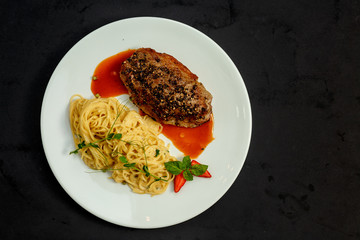 juicy cutlet with pepper and Italian spaghetti with sauce
